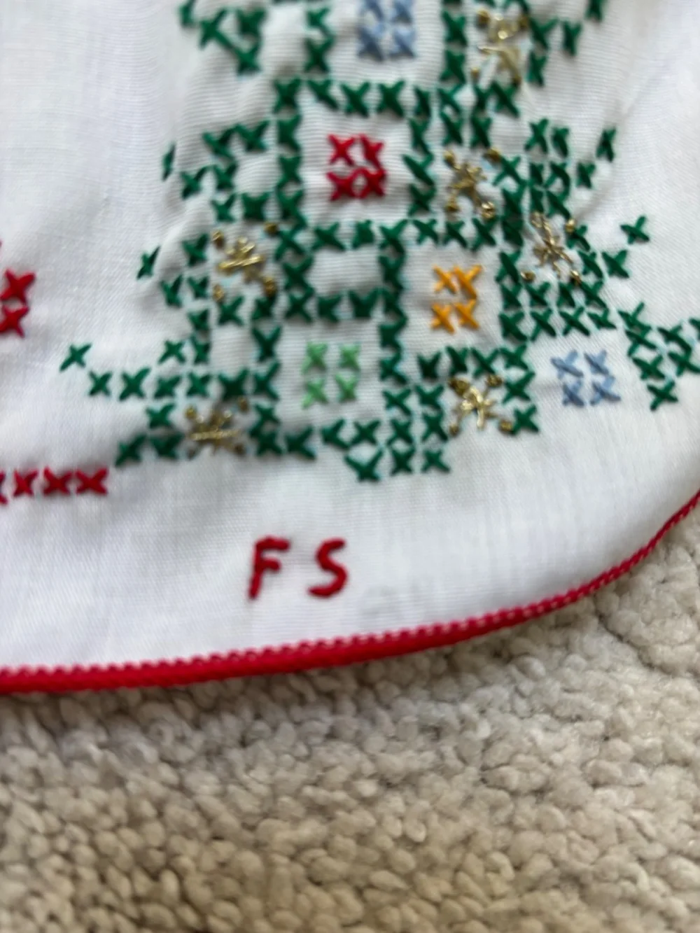 Vintage white half apron featuring hand-stitched cross-stitch Christmas trees